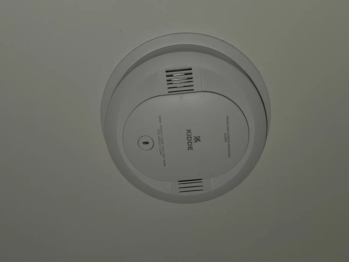 Smoke alarm mounted on a ceiling