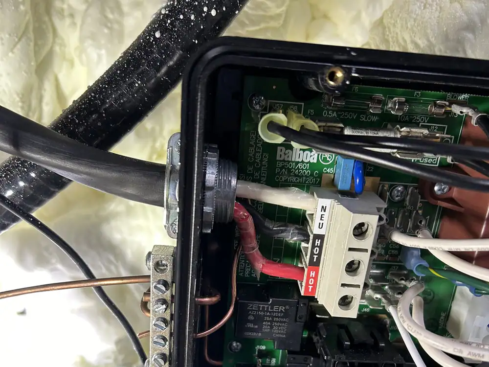An open electrical enclosure with its wires and components exposed during a repair in Hayes Barton, Raleigh