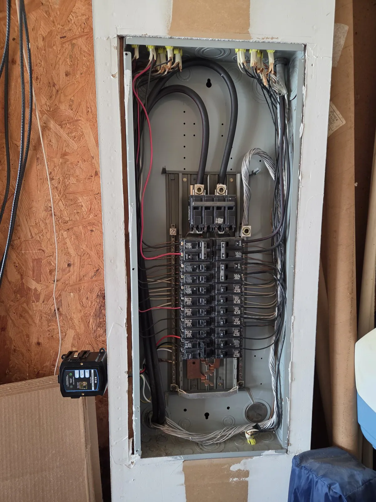 Open electrical panel with its wires exposed during the installation, in Wakefield, Raleigh