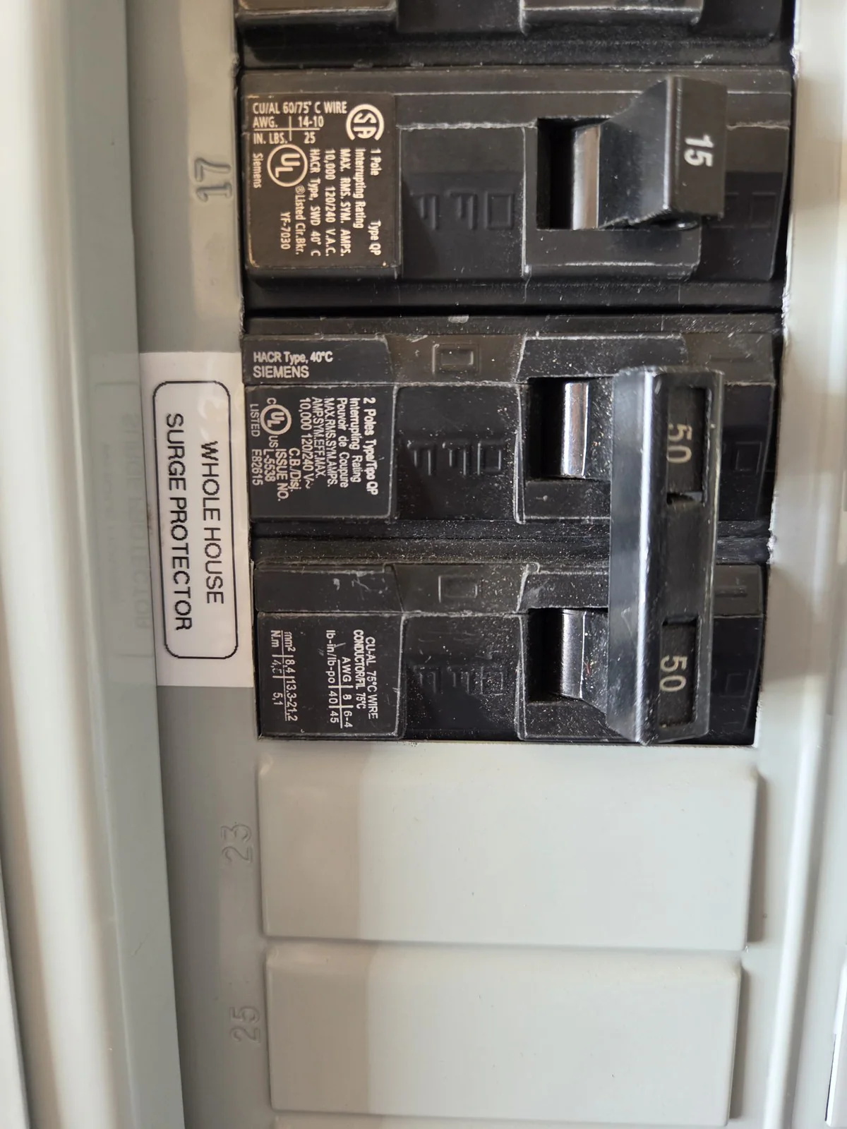 Close-up of a whole-house surge protector label on an electrical panel, in Wakefield, Raleigh