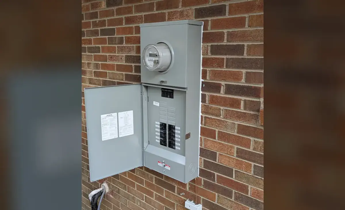 Completed exterior 200-amp Siemens meter-main panel upgrade at a Raleigh home