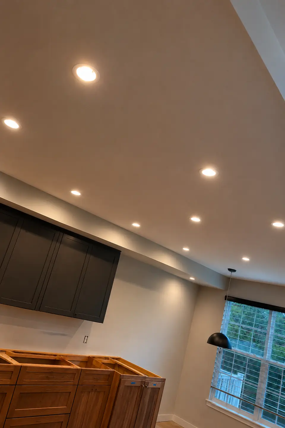 Completed recessed lighting upgrade in a Raleigh kitchen