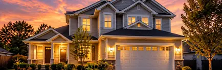 Newer two-story home with a two-car garage at sunset