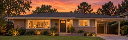 1960s single-story ranch house with a low roofline and carport